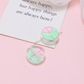 Detailed macro view of pastel acrylic beads with pink and green patterns for DIY jewelry - Pink Green Round