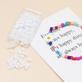 Macro detail of white 4mm triangle beads in a box for DIY handmade jewelry crafts - 10g Per Box / White