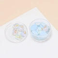 Close-up of light blue ripple jelly resin charms with pearl luster in clear plastic boxes - 10 Pieces Pack / Light Blue