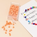 Detail of 4mm orange glass seed beads in a clear box for DIY jewelry and bracelets - 10g Per Box / Orange