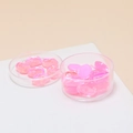 Nahaufnahme von durchscheinenden rosa Kristallsteinen in Schalen für DIY-Schmuckherstellung - 10 Stück Packung / Rosa