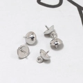 Close-up of silver bell caps with spiral pins for DIY pearl pendant jewelry making - Large Round Silver