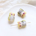 Close-up of yellow owl ceramic beads for DIY jewelry making with smooth glazed finish - Owl Style (3#) / 1 Piece / Yellow