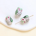 Detailed macro view of ceramic owl beads with top-to-bottom holes for DIY jewelry making - Owl Shape (4#) / 1 Piece / Green