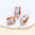 Macro view of owl-shaped ceramic beads showing hole structure for DIY jewelry making - Owl (5#) / 1 Piece / Orange