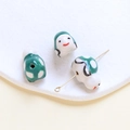 Detailed close-up of handmade ceramic beads with painted smile faces on a white tray - Turtle (12#) / 1 Piece / Dark Green