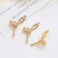 Détail de trois pendentifs nœuds dorés avec zircons pour la création de bijoux DIY - 1# Or K (Gauche) / Pièce Unique