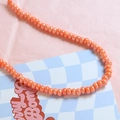 Close-up of glossy orange ceramic beads for DIY jewelry making and handmade necklaces - Orange (3#)