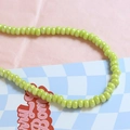 Macro detail of glossy lime green ceramic beads for DIY jewelry and necklace crafting - Light Green (9#)