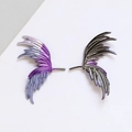 Detailed macro view of asymmetric purple and silver metal wing ear cuffs with feather texture - Gun Black