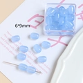 Vue détaillée de perles en verre bleu clair 6x9mm pour création de bijoux artisanaux - Perle Tonneau (6# Bleu) / 6x9mm / 6# Bleu Marbre