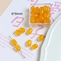 Détail macro de perles de résine ambre en forme de tonneau de 6x9mm pour bijoux DIY - Perle Tonneau (8# Orange) / 6x9mm / 8# Orange