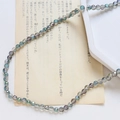 Vue macro de perles en cristal gris foncé avec revêtement AB iridescent pour bijoux DIY - Style Facetté Fin / Gris Profond Iridescent AB
