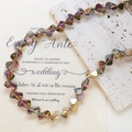 Detail of iridescent AB faceted crystal beads and gold spacers on a warm beige background - 1 Strand (Approx. 46 Beads) / Gold