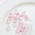 Macro detail of cubic glass beads with bubble effect and pink gradient for DIY jewelry - 20 Pieces Pack / Pink
