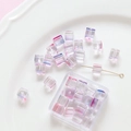 Macro shot of iridescent cube glass beads for DIY jewelry making in a decorative dish - 20 Pieces Pack / 4# Purple Pink