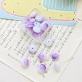 Detail of purple gradient glass saucer beads showing smooth texture and center hole - 10 Pieces Pack / Purple