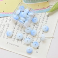Macro shot of gradient blue and white glass flat round beads for DIY jewelry making - 10 Pieces Pack / Sky Blue