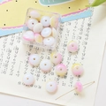 Close-up of pink and yellow gradient flat round glass beads for DIY jewelry making - 10 Pieces Pack / Yellow-Pink