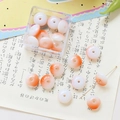 Macro view of gradient orange-pink flat round beads in a clear acrylic storage box - 10 Pieces Pack / Orange