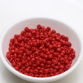 Detailed top view of 4mm red lacquered seed beads in a white bowl for DIY jewelry making - 4mm / Retro Copper