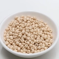 Detailed close-up of 4mm off-white round ceramic beads for DIY jewelry making in a white bowl - 4mm / Khaki