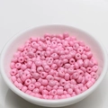 Macro view of 4mm pink lacquered porcelain beads in a white bowl for DIY jewelry making - 4mm / Peach Pink