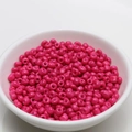 Macro detail of 4mm polished rose red round glass seed beads for DIY jewelry making - 4mm / Rose Red
