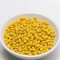 Macro shot of 4mm bright yellow beads for DIY jewelry making in a white ceramic bowl - 4mm / Yellow