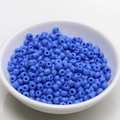 Macro shot of 4mm bright blue seed beads in a white bowl for DIY jewelry making - 4mm / Denim Blue