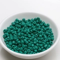Macro shot of 4mm teal green lacquered ceramic seed beads for DIY jewelry making - 4mm / Malachite green