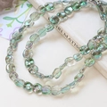 Close-up of iridescent square glass beads with aurora coating for DIY jewelry making - 4# Fresh Green