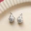 Detail of silver hollowed gourd pendants with traditional carvings on ceramic tray - Silver Gourd