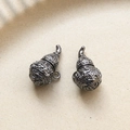 Detailed view of dark grey metallic gourd pendants with Fu character and coin patterns - Gun Black Gourd