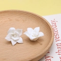 Macro detail of white ceramic-style flower beads with golden metal ring for DIY jewelry - 2#