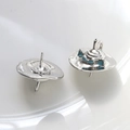 Detailed view of silver sombrero stud earrings with blue-green enamel decorative coating - Platinum Hat (8#)