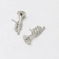 Detailed macro view of silver trumpet-shaped earring components for DIY jewelry making - Horn / White Gold