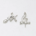Detail of silver bow jewelry finding with white zircon inlay and pearl pin connector - Rhinestone Inlaid Clasp / White Gold