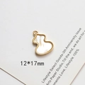 Detail view of 12x17mm gold-plated gourd pendant with faux mother of pearl inlay - Gourd