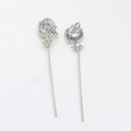 Detail of silver globe earrings with cubic zirconia stars and long metal fringe tassels - White Gold