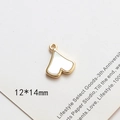 Detail view of a 12x14mm gold-plated heart pendant with white faux mother of pearl inlay - Heart