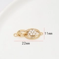 Gros plan d'un fermoir de bijoux doré de 11x22mm avec fleur en cristal et dimensions - Style Fleur Ovale Unique (5#)