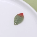 Macro shot of red-green gradient heat shrink leaf pendant with detailed vein patterns - Leaf (08#)