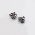 Close-up of black crown charm with pink crystals and petal base for DIY pearl pins - Gunmetal