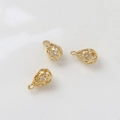 Detailed view of hollow gold-plated teardrop charms with zircon inlays for DIY jewelry - Pattern 9 (5x8mm)
