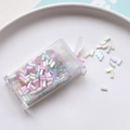 Macro shot of colorful 2mm glass tube beads in a plastic box for DIY embroidery - Multicolor