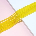 Macro shot of 4mm bright yellow faceted crystal bicone beads for DIY jewelry making - 04# Yellow
