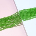 Close-up of 4mm grass green faceted crystal glass bicone beads for DIY jewelry making - 06# Green