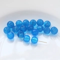 Close-up of blue glass beads with internal spiral texture for DIY jewelry making - Lake Blue