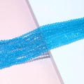 Close-up of light blue faceted crystal bicone beads for DIY jewelry making and crafts - Sky Blue